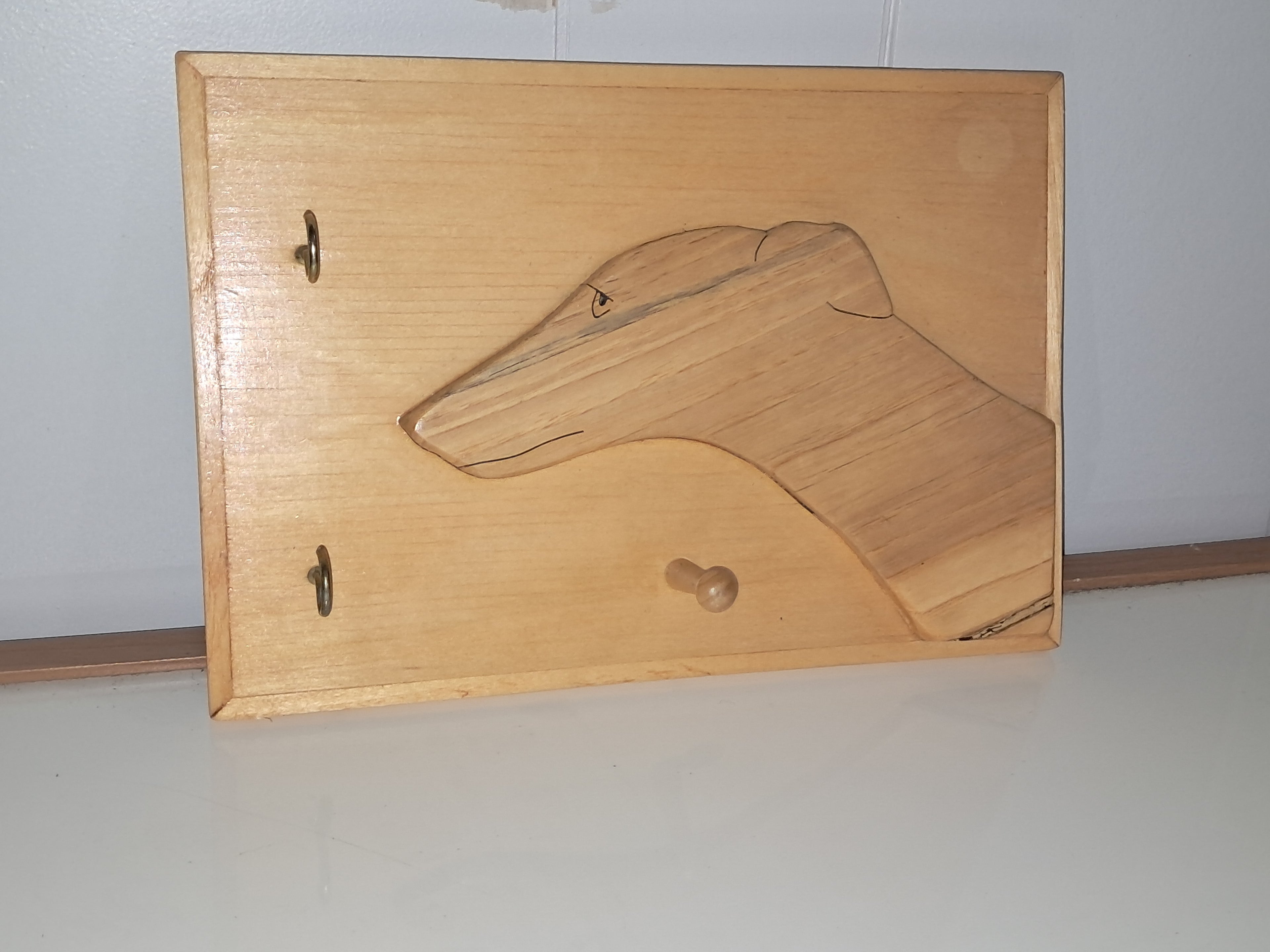 Greyhound leash holder